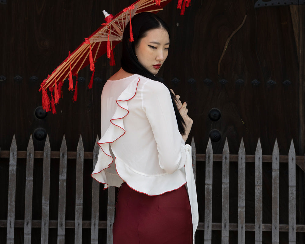 Blouse with frills