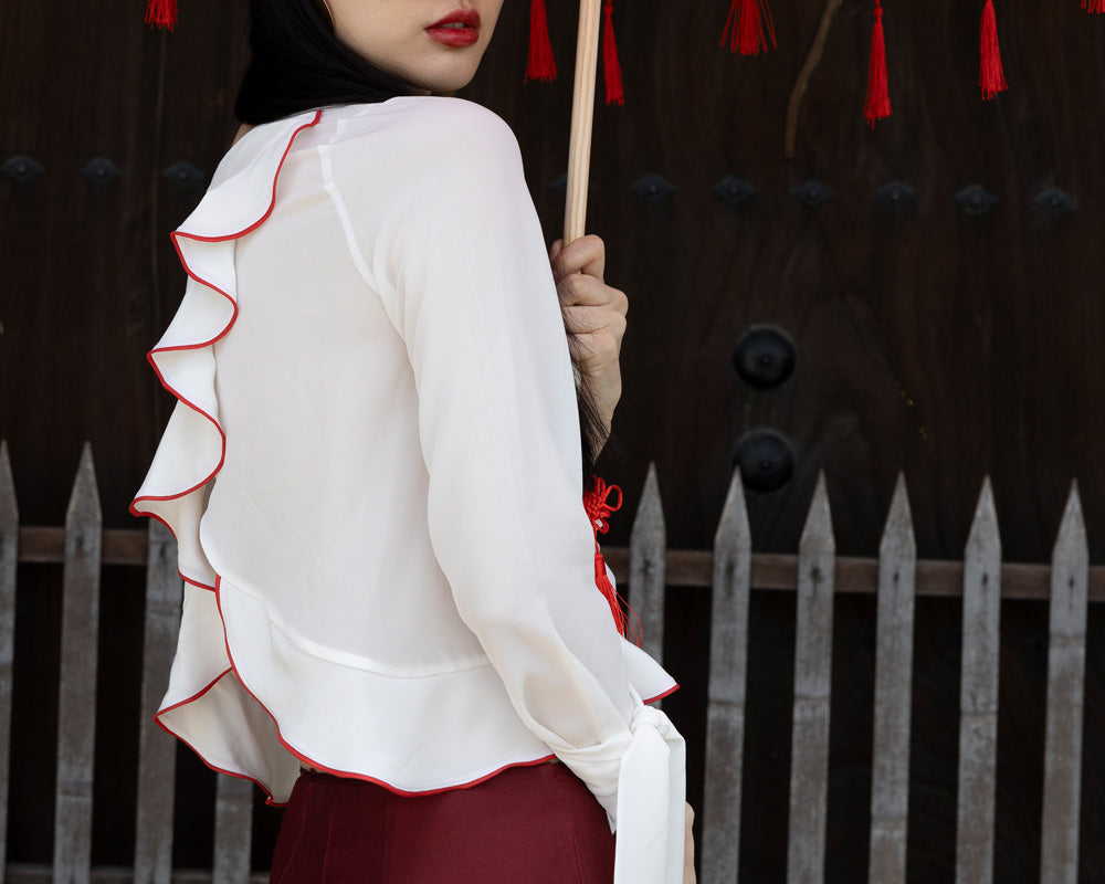 Blouse with frills